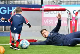 Defender Leon McCann takes a shot at being a goalkeeper