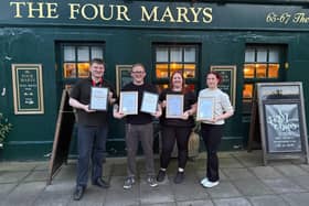 Team leader Iskander Turan, Ian Riddle, assistant manager Nikki McLintock and team leader Catherine Bain with awards.