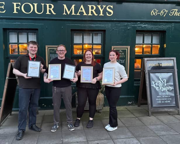 Team leader Iskander Turan, Ian Riddle, assistant manager Nikki McLintock and team leader Catherine Bain with awards.