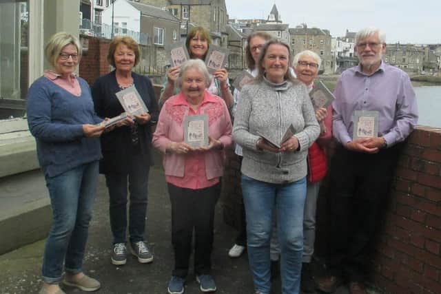 Members of Queensferry History Group, pictured with the booklet.