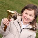 Mila Sneddon, 6, rings the bell as she is in remission from acute lymphoblastic leukaemia
