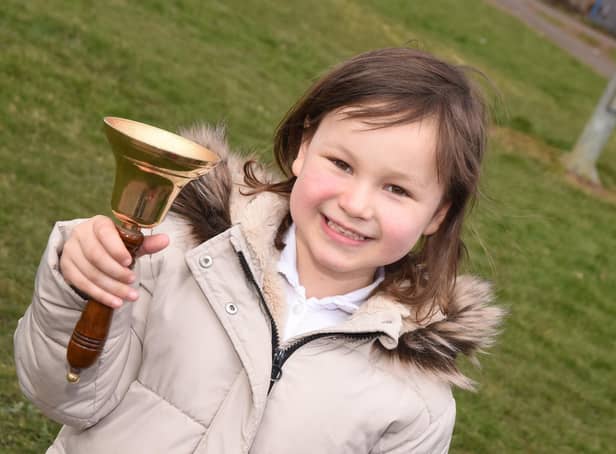 Mila Sneddon, 6, rings the bell as she is in remission from acute lymphoblastic leukaemia