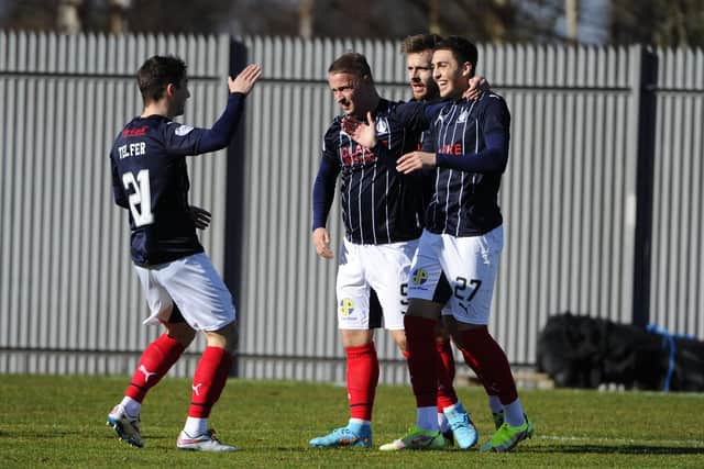 Jaze Kabia is mobbed by his teammates after scoring against Dumbarton (Picture: Alan Murray)