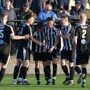 Dunipace's Kai Wilson is mobbed by his teammates after scoring to make it 2-2 at the start of the second half against Linlithgow Rose (Pictures by Michael Gillen)