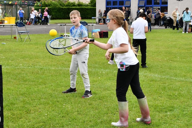 Budding tennis stars try their hand with a raquet