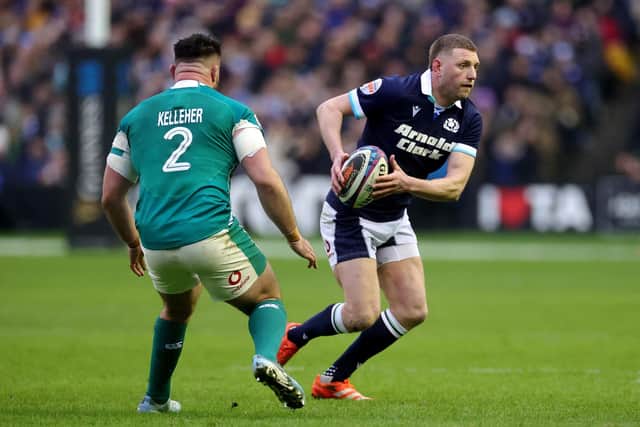 Ex-Falkirk ace Finn Russell runs with the ball whilst under pressure from Ronan Kelleher of Ireland (Photo: Getty Images)