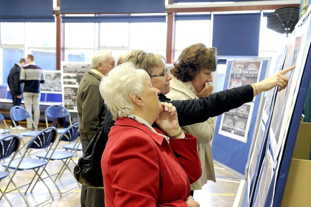 Visitors looking at the exhibition.