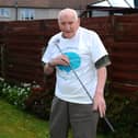 Grangemouth resident Donald Walls, 92, was inspired by the efforts of Captain Tom as he holed 100 putts for Strathcarron Hospice. Picture: Michael Gillen.