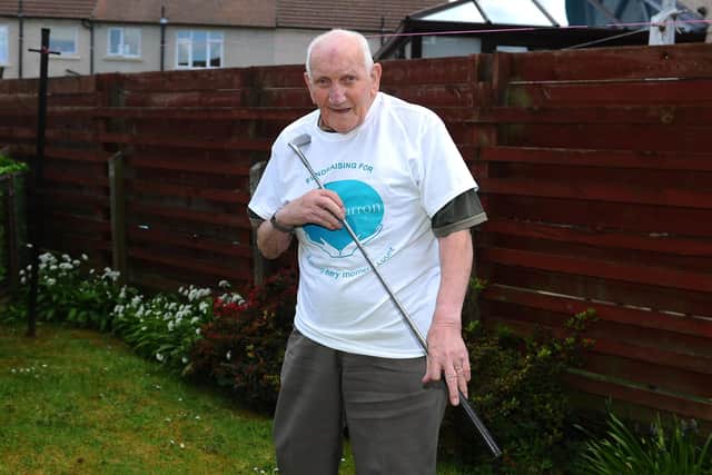 Grangemouth resident Donald Walls, 92, was inspired by the efforts of Captain Tom as he holed 100 putts for Strathcarron Hospice. Picture: Michael Gillen.