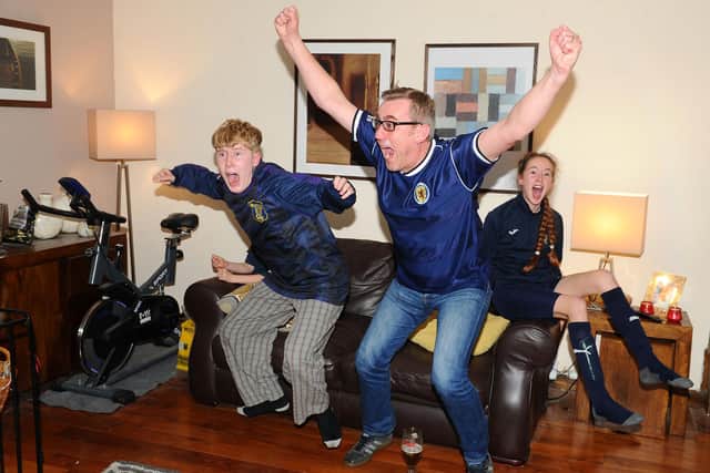 The Robertson family going through all the emotions of being Scotland fans and finally seeing Scotland make it to the final of a major tournament for the first time in 22 years. Pictured  are Emma Robertson 8; Erin Robertson 11; Conor Robertson 14; Dad, Gordon Robertson; Mum, Sharon Robertson and Millie the cockapoo. (Pic: Michael Gillen)