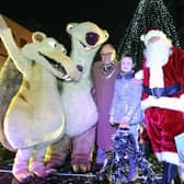 Provost Pat Reid and Darcy Dewar 9 from Avonbridge switch on the Christmas lights with Santa and Ice Age characters Sid and Scrat.