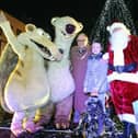 Provost Pat Reid and Darcy Dewar 9 from Avonbridge switch on the Christmas lights with Santa and Ice Age characters Sid and Scrat.