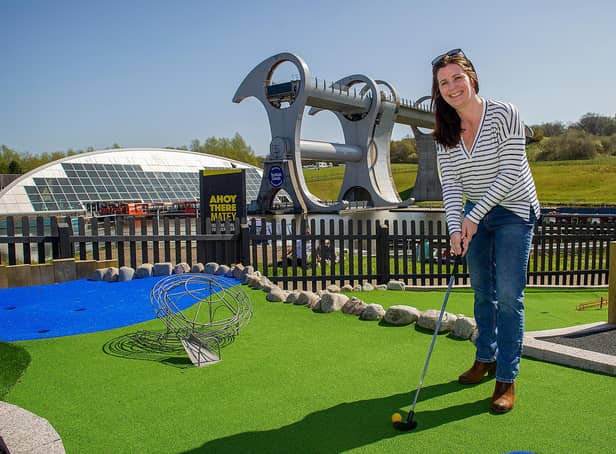 Catherine Topley, CEO at Scottish Canals, tries  out the new crazy golf attraction at The Falkirk Wheel.