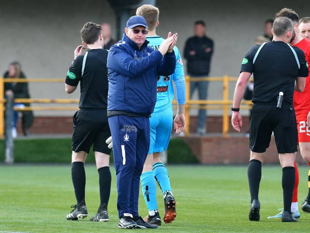 Falkirk manager John McGlynn applauds the travelling support after his side's 4-1 win over Alloa Athletic (Pictures by Michael Gillen)