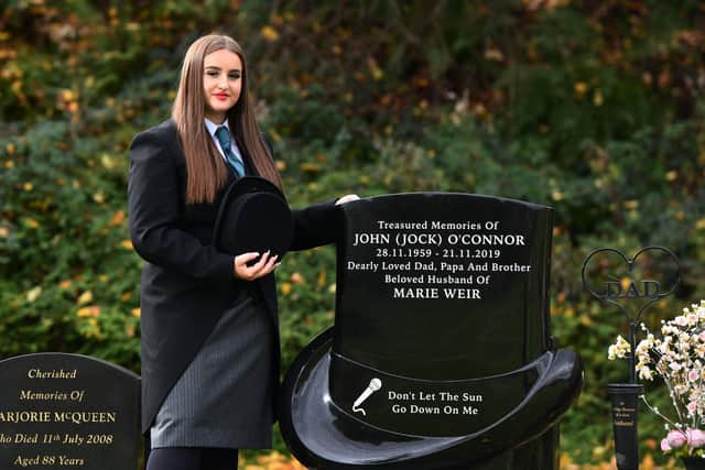 Karla O'Connor at their graveside of her papa John O'Connor who started the family business in 2003