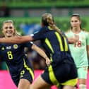 EDINBURGH, SCOTLAND - OCTOBER 29: Samantha Kerr of Scotland celebrates scoring her team's first goal with teammate Lisa Evans during the UEFA Women's EURO 2025 Play-Off Round One Second Leg match between Scotland and Hungary at Easter Road on October 29, 2024 in Edinburgh, Scotland. (Photo by Ian MacNicol/Getty Images)