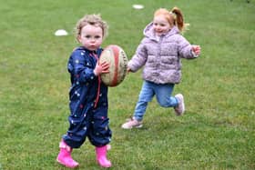 Paige Anderson, 2, and Raya Bowden, 2, from Bo'ness enjoy some touch rugby fun at the Purple Rhino launch