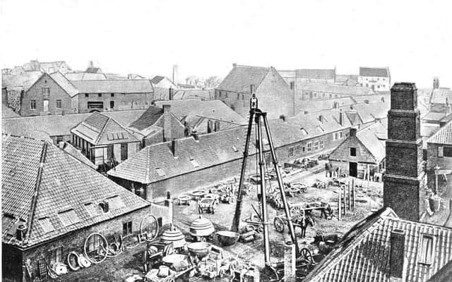 The Carron Iron Works 'triangle' with its bell on top.