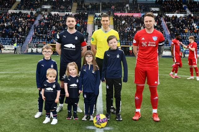 Falkirk's matchday mascots with captain Stephen McGinn