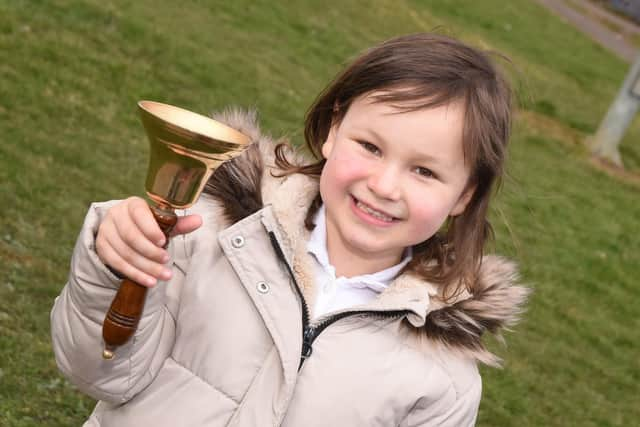 Mila Sneddon, 6, rings the bell as she is in remission from acute lymphoblastic leukaemia