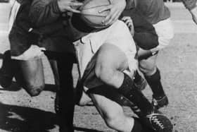 Who is this former Welsh stand-off and Question of Sport captain, pictured in 1955? (Photo: Getty Images)