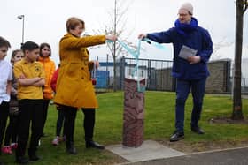 Caspar Wilson, right, and fellow artist Nicola Atkinson, unveil one of the waymarkers in Maddiston which where commissioned by Falkirk Council and Paths for All in 2019 as part of the Take the Right Route initiative