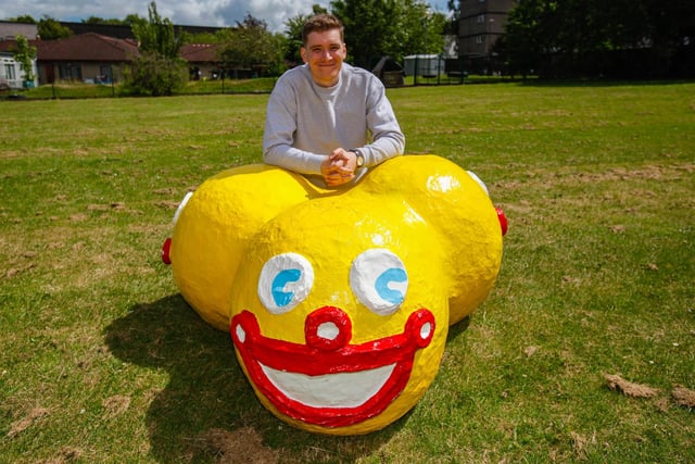Artist Lewis Bissett from Camelon with his work "Mariner Buoys" created with papier mache and gloss radiator paint