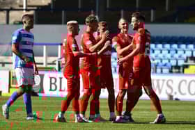 Falkirk's players celebrate Brad McKay's spot kick (Photos: Michael Gillen)