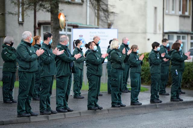 The funeral procession of Scottish Ambulance Service paramedic Rod Moore passed Falkirk Ambulance Station in Grangemouth Road where colleagues and friends paid their respects before moving on to Grandsable Cemetery in Polmont. Picture: Michael Gillen.