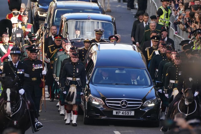 King Charles III and members of the royal family join the procession of Queen Elizabeth's coffin from the Palace of Holyroodhouse to St Giles' Cathedral, Edinburgh