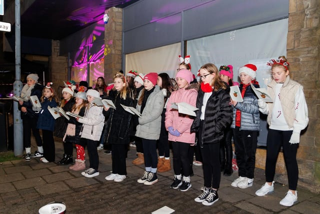 A Glee choir braved the cold to entertain the shoppers.