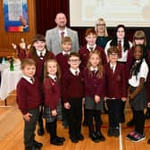 Headteacher Thomas McGovern, depute headteacher Laura Wilson and Archbishop Leo Cushley with some pupils from the school at the 60th anniversary mass.