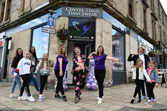 Centre Stage Dancewear opened in Melville Street, Falkirk in August. Pictured: owners Lesley Ann Craig (left) and Leigh White (right) watch on as Irene Langlands (centre), founder of Stenhouse School of Dance, opens the new shop. Picture: Michael Gillen.