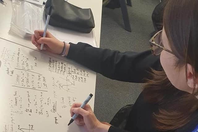 Working out equations on desks at the Academy was praised by inspectors.