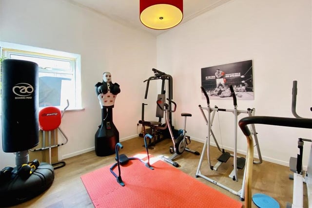 One of the five bedrooms is being used as a gym.