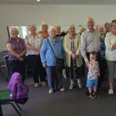 Margaret Paton, chairperson of Laurieston Old Folks Welfare Association, accepts a cheque for £500 from Rotarians Charlie Morrison and Mary Sneddon.  (pic: submitted)