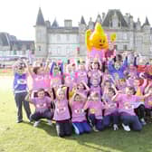 Eilidh Child now Eilidh Doyle with some of the children and Dart the mascot.