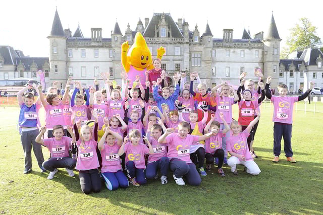 Eilidh Child now Eilidh Doyle with some of the children and Dart the mascot.