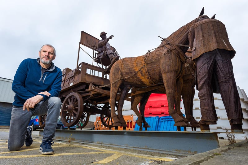 The highly-detailed sculpture includes spokes on the wheels.