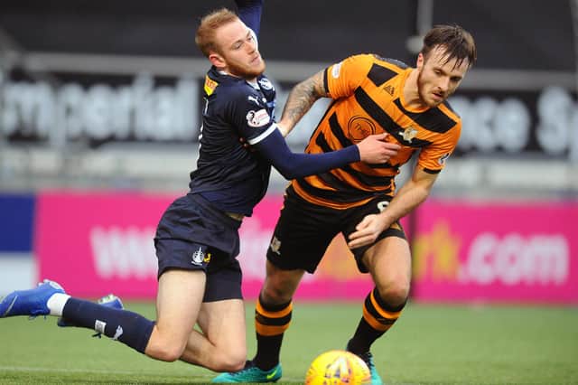 Falkirk's Steven Hetherington fouling Alloa's Zak Rudden the last time the two sides met back in April 2019 (Pic: Michael Gillen)