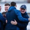 MONTROSE, SCOTLAND - MARCH 30: Falkirk players and staff celebrate after being crowned League 1 champions during a cinch League One match between Montrose and Falkirk at Links Park Stadium, on March 30, 2024, in Montrose, Scotland.  (Photo by Sammy Turner / SNS Group)