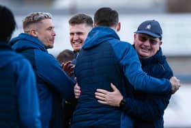 MONTROSE, SCOTLAND - MARCH 30: Falkirk players and staff celebrate after being crowned League 1 champions during a cinch League One match between Montrose and Falkirk at Links Park Stadium, on March 30, 2024, in Montrose, Scotland.  (Photo by Sammy Turner / SNS Group)
