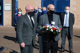 Paying tribute: Alex Totten and Falkirk club chairman, Gary Deans wait to lay a wreath in memory of well known goalkeeper Willie Whigham who died at the age of 81 (Pic: Michael Gillen)