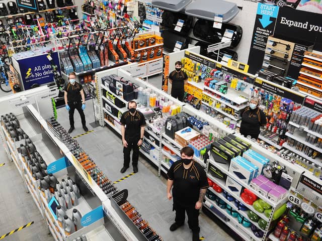 Halfords in Falkirk's Central Retail Park reopened on March 25 after an electrical fire forced it to close for eight months. Manager Greg Dornan (top left) with colleagues. Picture: Michael Gillen.