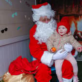 One -year-old Freya meets Santa at the Go Forth and Clyde event