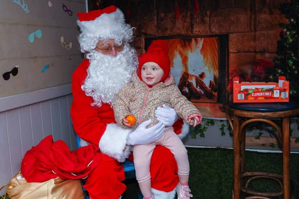 One -year-old Freya meets Santa at the Go Forth and Clyde event