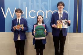 Pictured from left, students Aiden Gallagher S5, Lauren Baird S6 and Noah Peggie S6 with their art work.  (Pic: submitted)