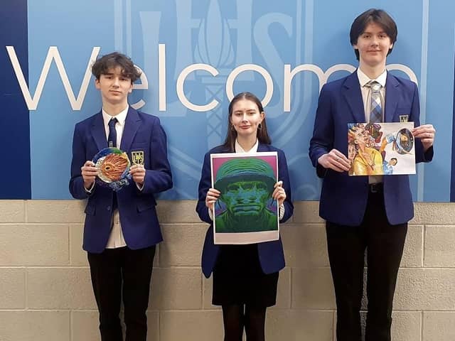 Pictured from left, students Aiden Gallagher S5, Lauren Baird S6 and Noah Peggie S6 with their art work.  (Pic: submitted)