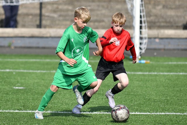 This St Mary’s Primary pupil has to watch out with a Bo’ness Public Primary player closing in on him