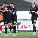 McGinn is congratulated by team-mates (Pic Alan Murray)